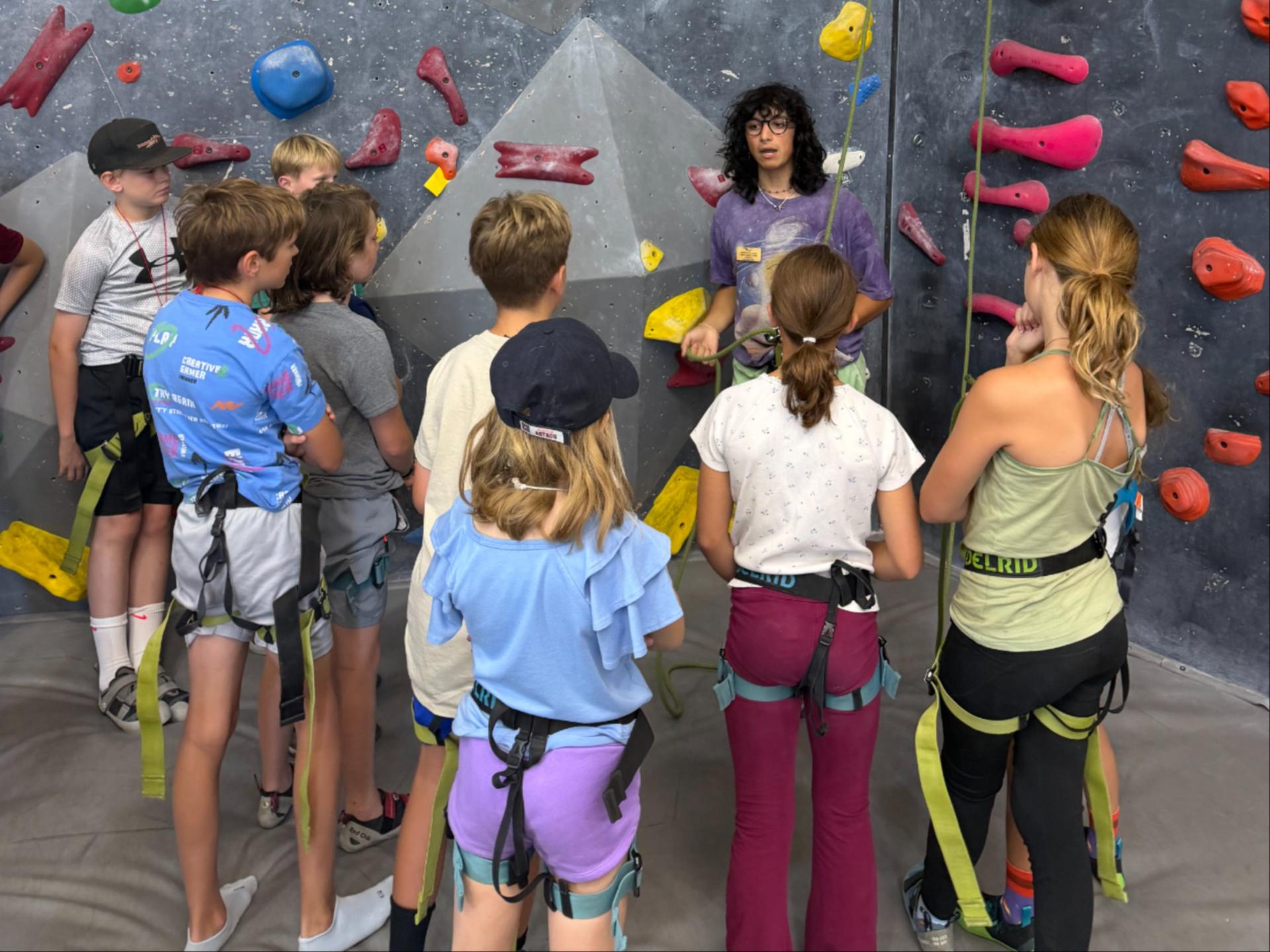 WRI Rock On! campers learning to climb and belay at the Riverfront Rock Gym in Wenatchee.