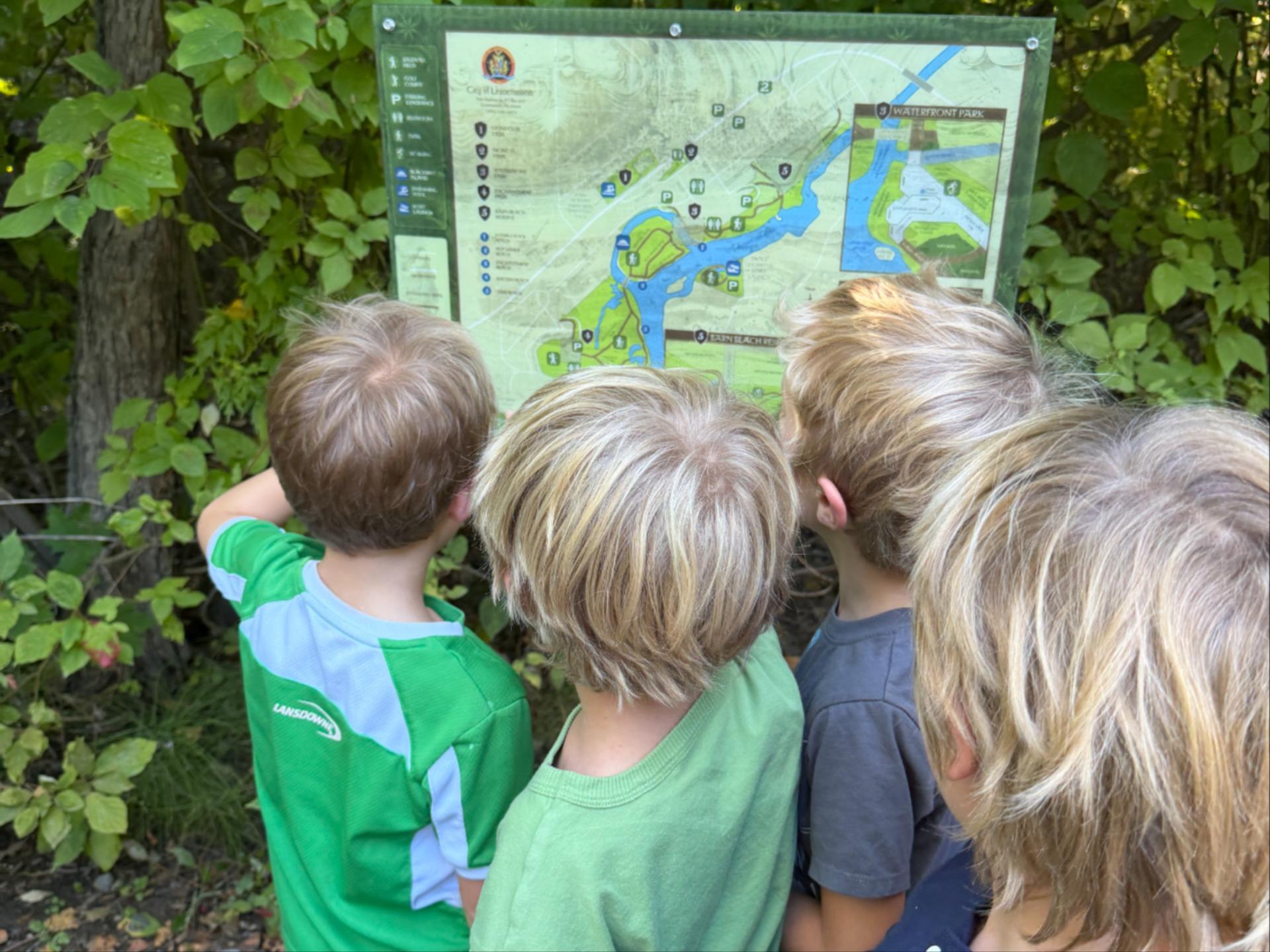 Kids from WRI After School Program reading the trail map of Leavenworth Waterfront Park. 