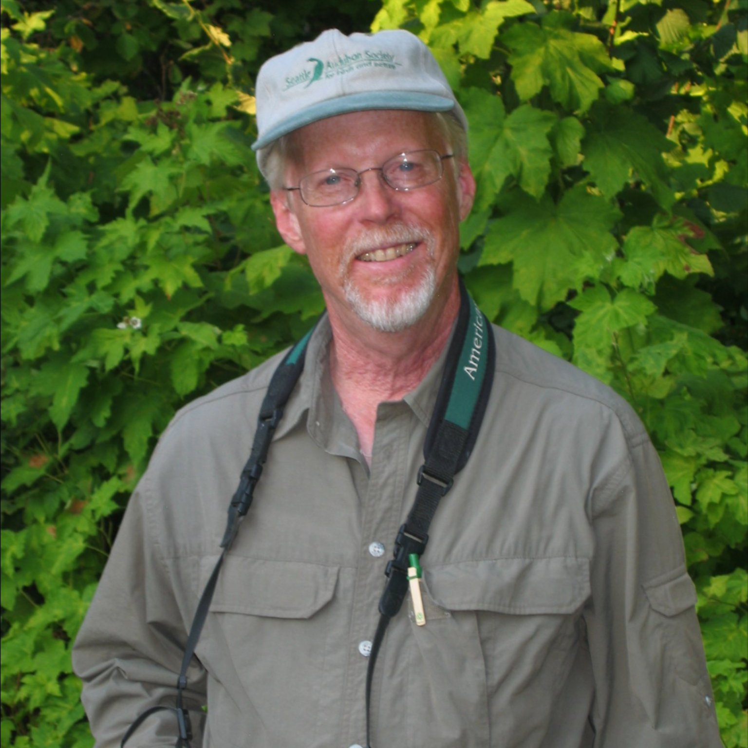 Image of Mark Johnston of Washington with binoculars around his neck.