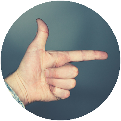 A hand with the index finger pointing to the right.